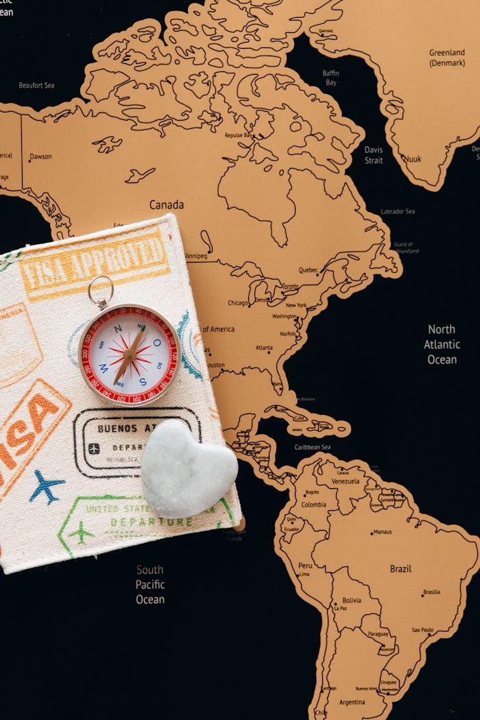 Crafting Captivating Headlines: Your awesome post title goes here Flat lay photo of a map, passport, and compass, symbolizing travel and adventure.